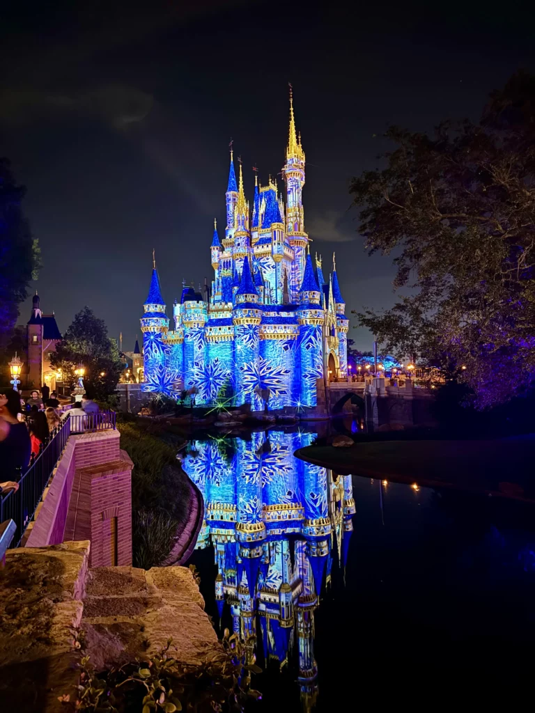 Cinderella's Castle at Walt Disney World's Magic Kingdom lit up at night with projection mapping