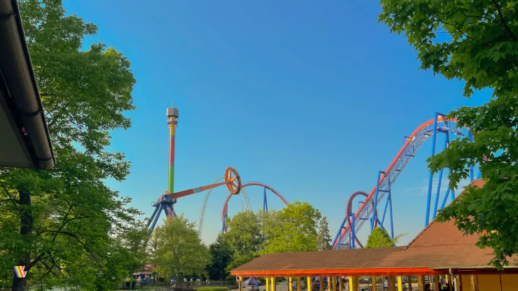 Delirium swinging high with Banshee roller coaster and Drop Zone also visible at Kings Island