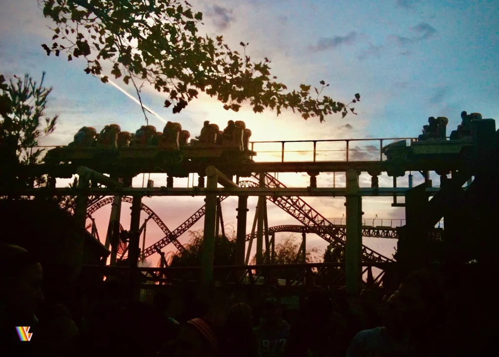 Looking at Maverick on the brake run with twisted roller coaster track behind it as sun sets at Cedar Point, a contender for the best theme park for roller coasters