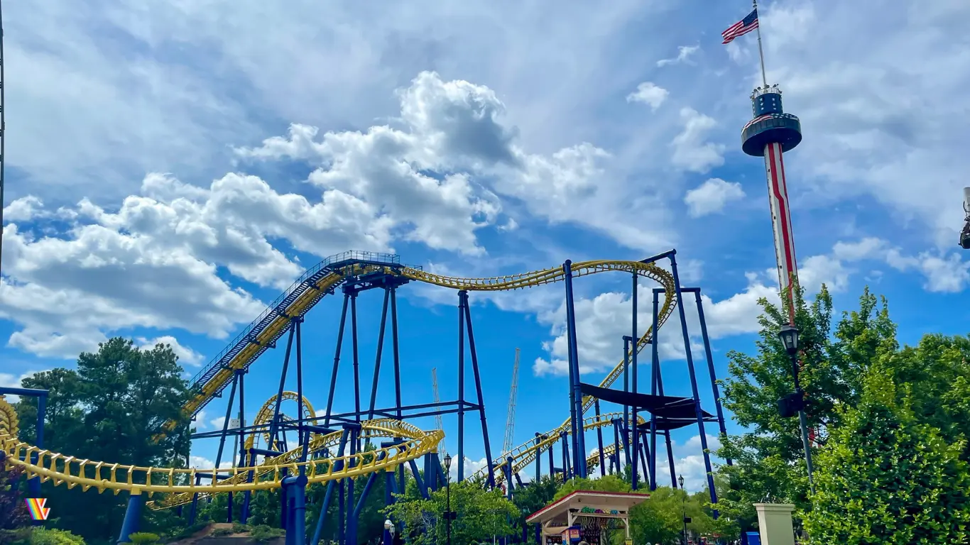 Nighthawk roller coaster as seen from inside Carowinds on a partly cloudy day